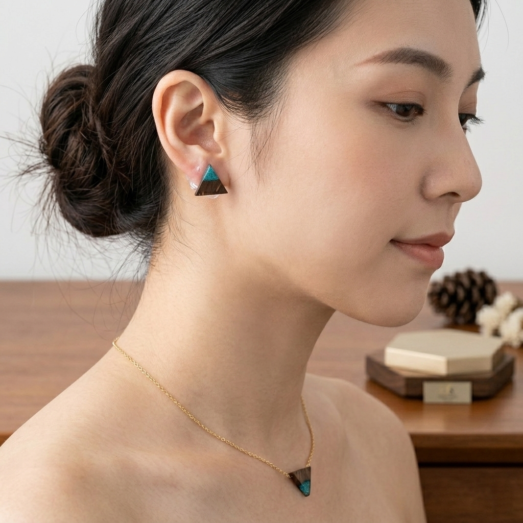 Close-up of a woman wearing turquoise earrings with a blurred background